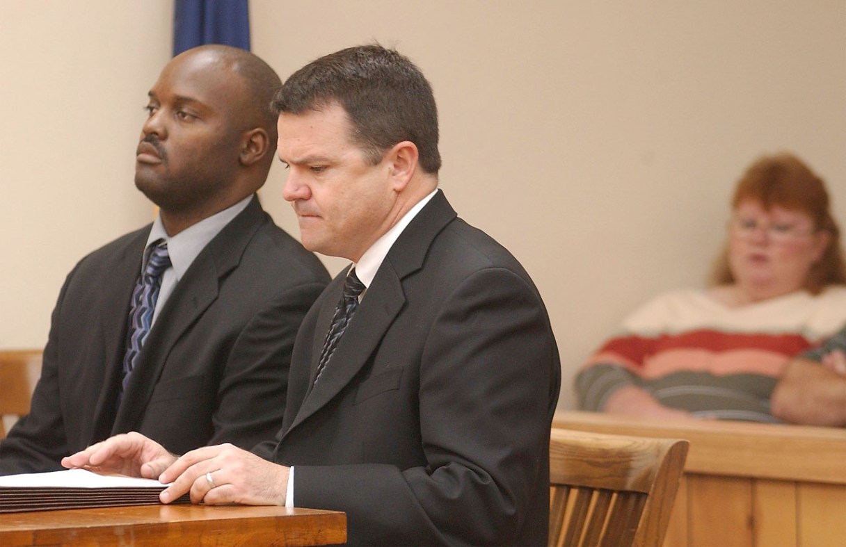 Former crematory operator Ray Brent Marsh, left, appeares in court for arraignment Tuesday, Sept. 23, 2003, in LaFayette, Ga., with his attorney Ken Poston. Lisa Cash, far right, watches the proceedings from the gallery. Marsh pleaded not guilty to 122 counts of burial service fraud and 47 counts of making false statements. Marsh, accused of dumping decaying bodies around his family business, faces multiple counts of burial service fraud, making false statements, abuse of a dead body and theft. He remains free on bond.
Staff File Photo