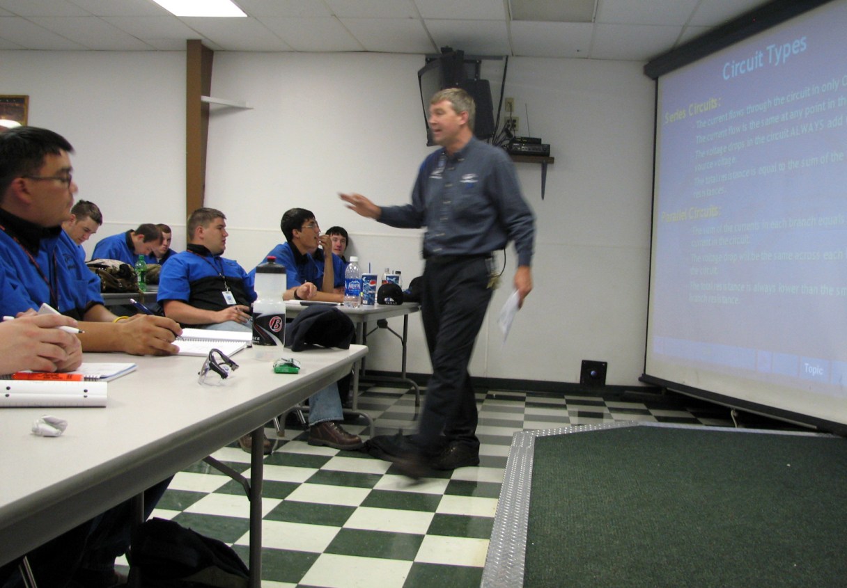 FILE - In this June 30, 2009 file photo, Larry Wostenberg teaches an engine management systems class at the WyoTech technical school campus in Laramie, Wyo. Corinthian Colleges Inc., the company that runs Everest, Heald and WyoTech colleges with about 75,000 students enrolled nationwide, on Thursday, June 19, 2014 said it’s in danger of shutting down. (AP Photo/Mead Gruver, file)