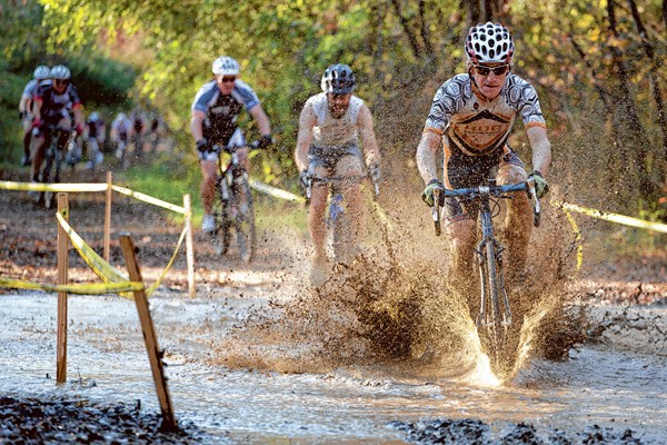 Riders shoot through water on the cyclocross course during the HUB Endurance Chattanooga CX II race at Greenway Farm.