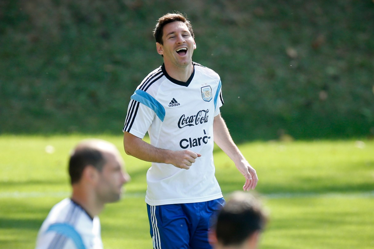 Argentina's Lionel Messi laughs during a training session in Vespasiano, near Belo Horizonte, Brazil, Friday, June 20, 2014. Argentina plays in group F of the 2014 soccer World Cup. (AP Photo/Victor R. Caivano)