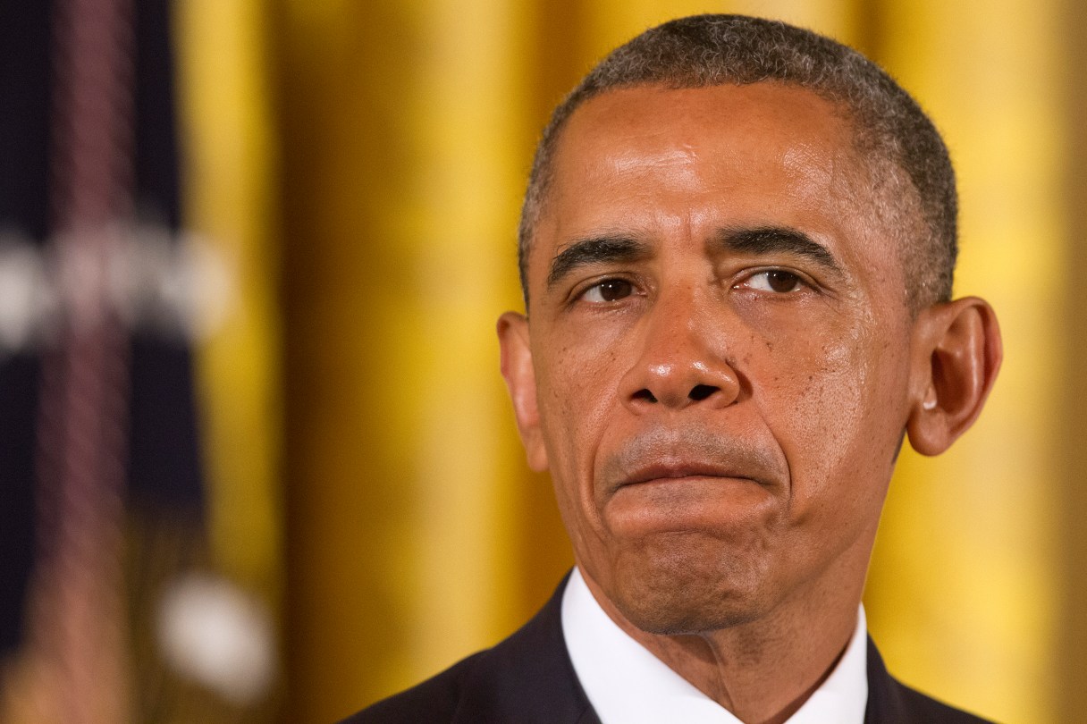 President Barack Obama pauses as he speaks before signing executive orders to protect LGBT employees from federal workplace discrimination in the East Room of the White House Monday, July 21, 2014, in Washington. Obama's executive orders signed Monday prohibit discrimination against gay and transgender workers in the federal government and its contracting agencies, without a new exemption that was requested by some religious organizations. (AP Photo/Jacquelyn Martin)