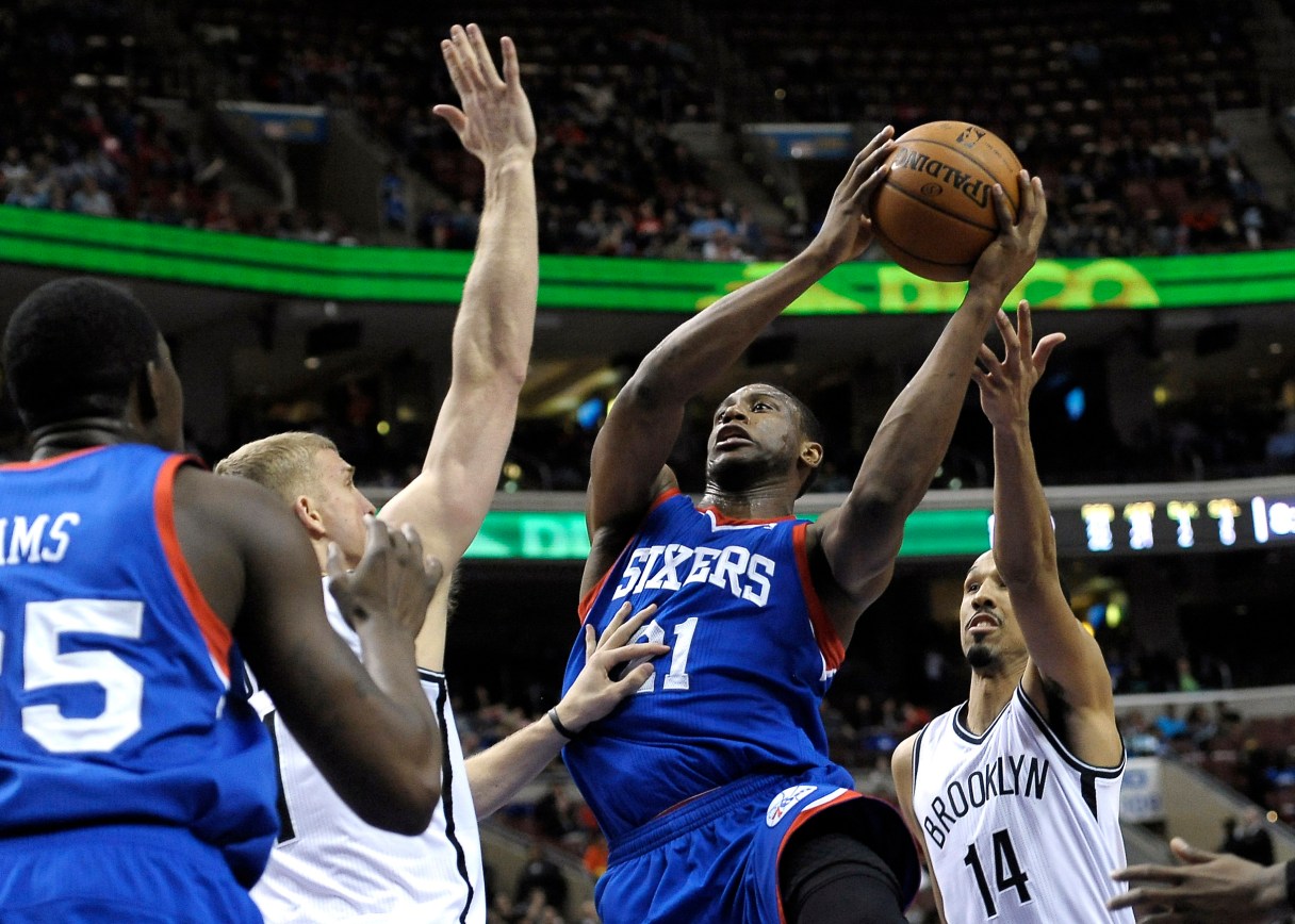 FILE - In this April 5, 2014, file photo, Philadelphia 76ers' Thaddeus Young goes to the basket against the Brooklyn Nets during an NBA basketball game in Philadelphia. A person with knowledge of the situation told The Associated Press that the Minnesota Timberwolves will receive Thaddeus Young as part of the deal that will send Kevin Love to the Cleveland Cavaliers. The person requested anonymity because an official announcement has not been made. (AP Photo/Michael Perez, File)