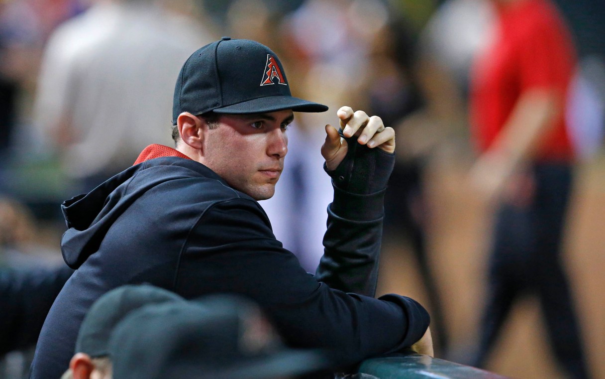 Arizona Diamondbacks first baseman Paul Goldschmidt watches the baseball game against the Pittsburgh Pirates with a cast on his hand, Saturday, Aug. 2, 2014, in Phoenix. (AP Photo/The Arizona Republic, David Kadlubowski)