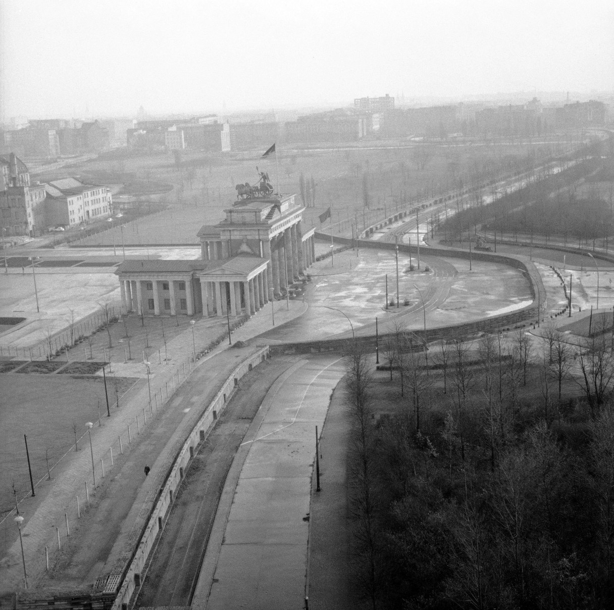 FILE - The Nov. 19, 1961 file photo shows a view from top of the old Reichstag’s building to the Brandenburg Gate, which marks the border in this divided city. The semi-circled wall around the Brandenburg Gate was erected by East German police. (AP Photo/E.Worth, file)
