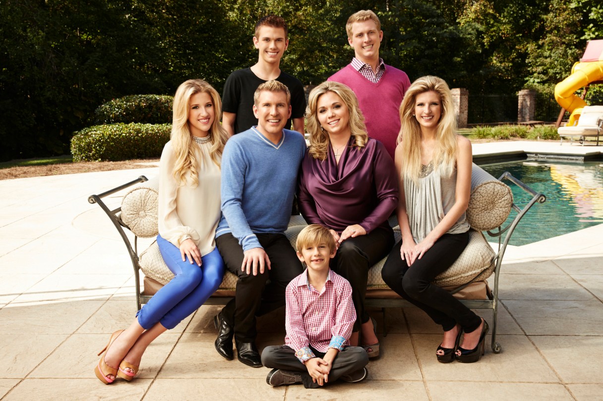 This Oct. 2, 2013 photo released by USA Network shows the cast of "Chrisley Knows Best," back row from left, Chase Chrisley and Kyle Chrisley, second row from left, Savannah Chrisley, Todd Chrisley, Julie Chrisley, and Lindsie Chrisley Campbell, and front center Grayson Chrisley, posing in Atlanta. The reality series airs on USA on Tuesdays. (AP Photo/USA Network, Tommy Garcia)