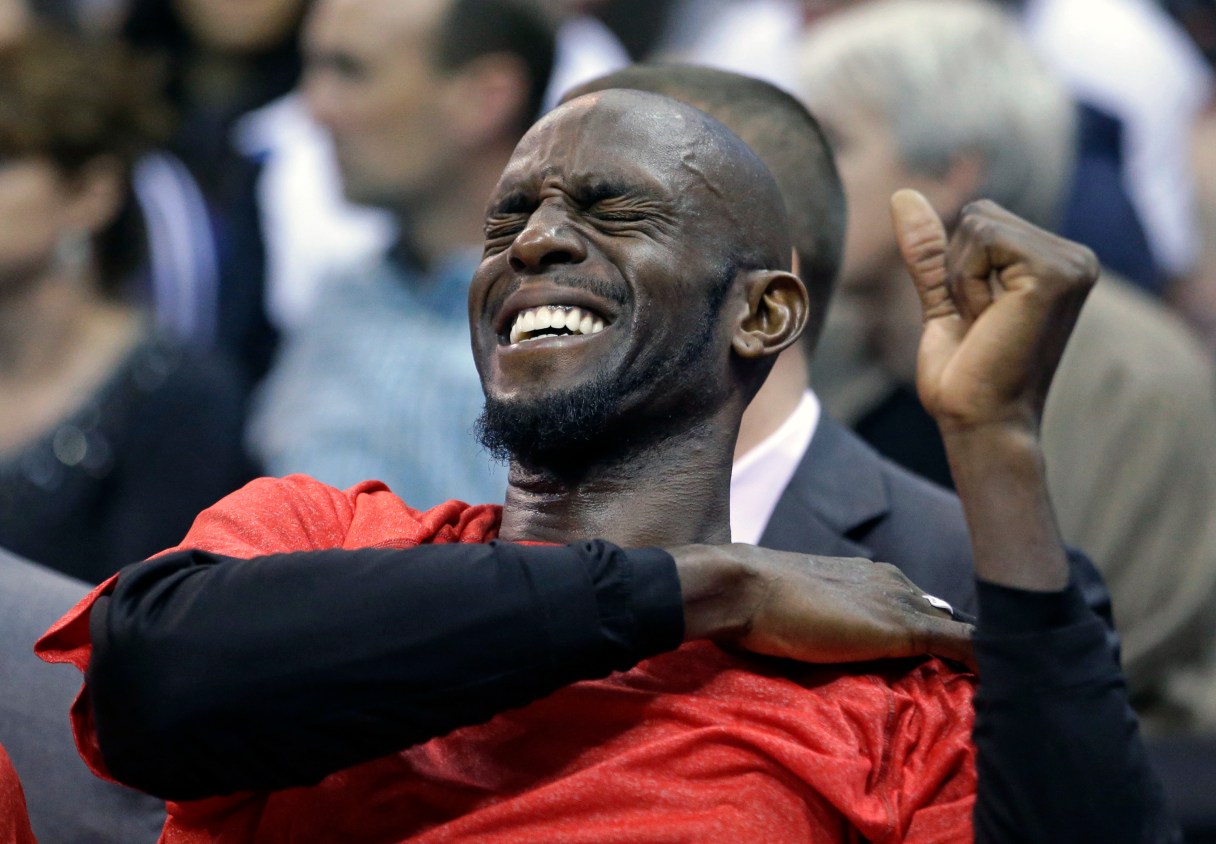 FILE - Brooklyn Nets forward Kevin Garnett holds his shoulder while sitting on the bench in the third quarter during an NBA basketball game against the Utah Jazz, in this Jan. 24, 2015 file photo taken in Salt Lake City. The Timberwolves and Brooklyn Nets are discussing a deal that would bring Garnett back to Minnesota, the place where his brilliant career began and to the franchise that he put on the map. The two teams had exploratory talks on Wednesday Feb. 18, 2015. (AP Photo/Rick Bowmer, File)