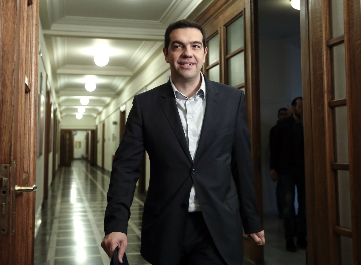 Greece's Prime Minister arrives for an inner cabinet, to brief it on the Eurogroup meeting and discuss the proposals, at the Greek Parliament in Athens on Saturday, Feb. 21, 2015. Tsipras hailed the "important success" of Greece's negotiations with its creditors a day earlier, but warned that more difficult consultations lie ahead. (AP Photo/InTime News, Kostas Baltas) GREECE OUT