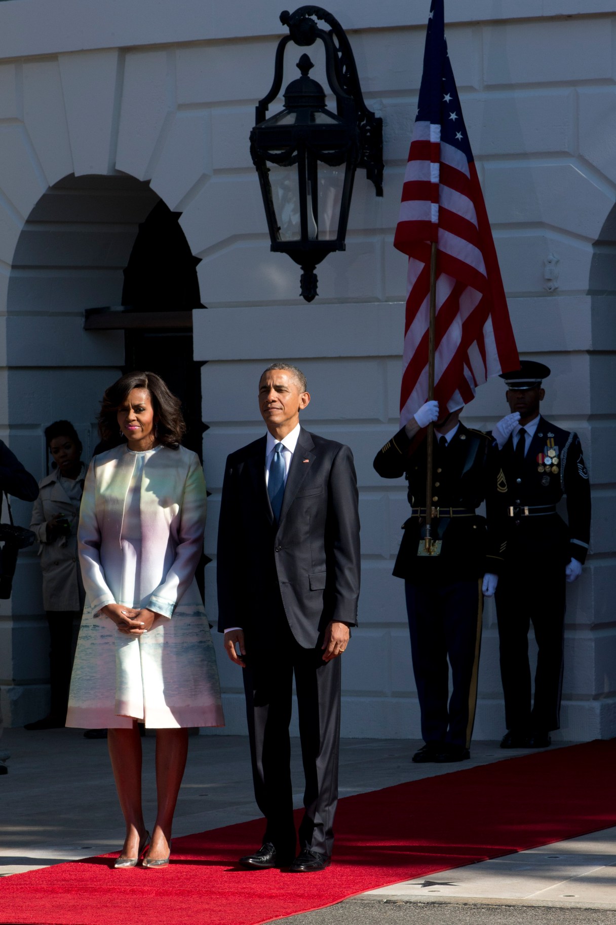 President Barack Obama and first lady Michelle Obama await the arrival of Japanese Prime Minister Shinzo Abe for a state arrival ceremony, Tuesday, April 28, 2015, on the South Lawn of the White House in Washington. (AP Photo/Jacquelyn Martin)