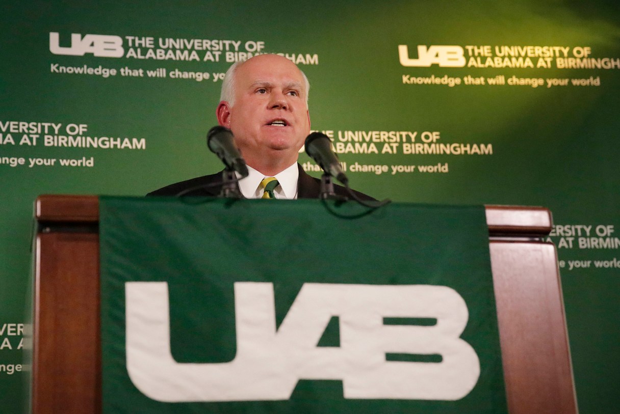 UAB President Ray Watts speaks during a news conference, Monday, June 1, 2015, in Birmingham, Ala. Watts is bringing the football program back. He told The Associated Press that he decided on Monday, June 1, 2015, to reverse the earlier decision after meetings with UAB supporters continued through the weekend. He says donors have pledged to make up the estimated $17.2 million deficit over the next five years if football is restored. Monday, June 1, 2015, in Birmingham, Ala.(AP Photo/Brynn Anderson)