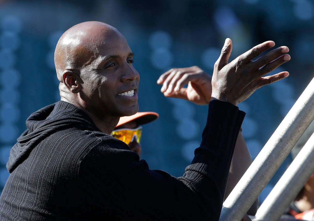 FILE - In this Friday, July 10, 2015, file photo, former baseball player Barry Bonds watches batting practice before a baseball game between the San Francisco Giants and the Philadelphia Phillies in San Francisco. A person familiar with the discussions says Bonds is talking with the Miami Marlins about working for them as a hitting coach. The person spoke to The Associated Press on condition of anonymity Monday, Nov. 30, 2015, because the discussions haven’t been confirmed publicly. (AP Photo/Jeff Chiu, File)