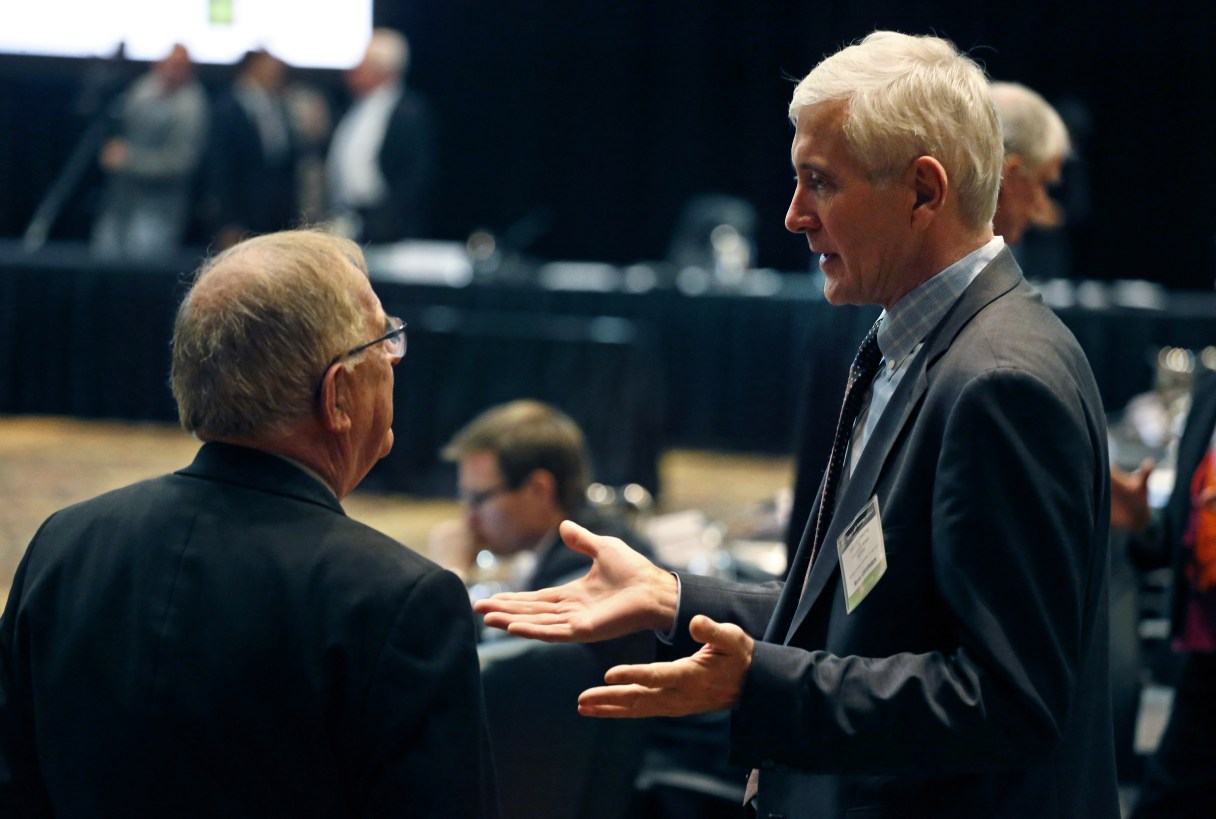 FILE - This is a Wednesday, Nov. 18, 2015 file photo of Norwegian anti-doping expert Rune Andersen, right, as he speaks with Warwick Gendall of New Zealand before a meeting of the World Anti-Doping Agency (WADA), at the Broadmoor Hotel in Colorado Springs. Rune Andersen the head of the IAAF taskforce set up to determine whether Russia's ban from global track and field should be lifted says the country is making efforts to reform after its doping scandal. (AP Photo/Brennan Linsley, File)