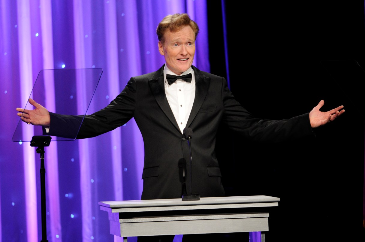 FILE - In this Oct. 8, 2014 file photo, Conan O'Brien addresses the audience during the 2014 Princess Grace Awards Gala in Beverly Hills, Calif. O’Brien will visit Harvard on Friday, Feb. 12, 2016, for a conversation about arts and education with university President Drew Faust followed by questions from the audience. (Photo by Chris Pizzello/Invision/AP, FIle)