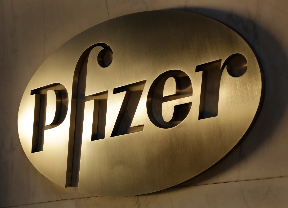 FILE - In this Monday, Nov. 23, 2015, file photo, the Pfizer logo is displayed at world headquarters, in New York. Pfizer reports financial results, Tuesday, Feb. 2, 2016. (AP Photo/Mark Lennihan, File)