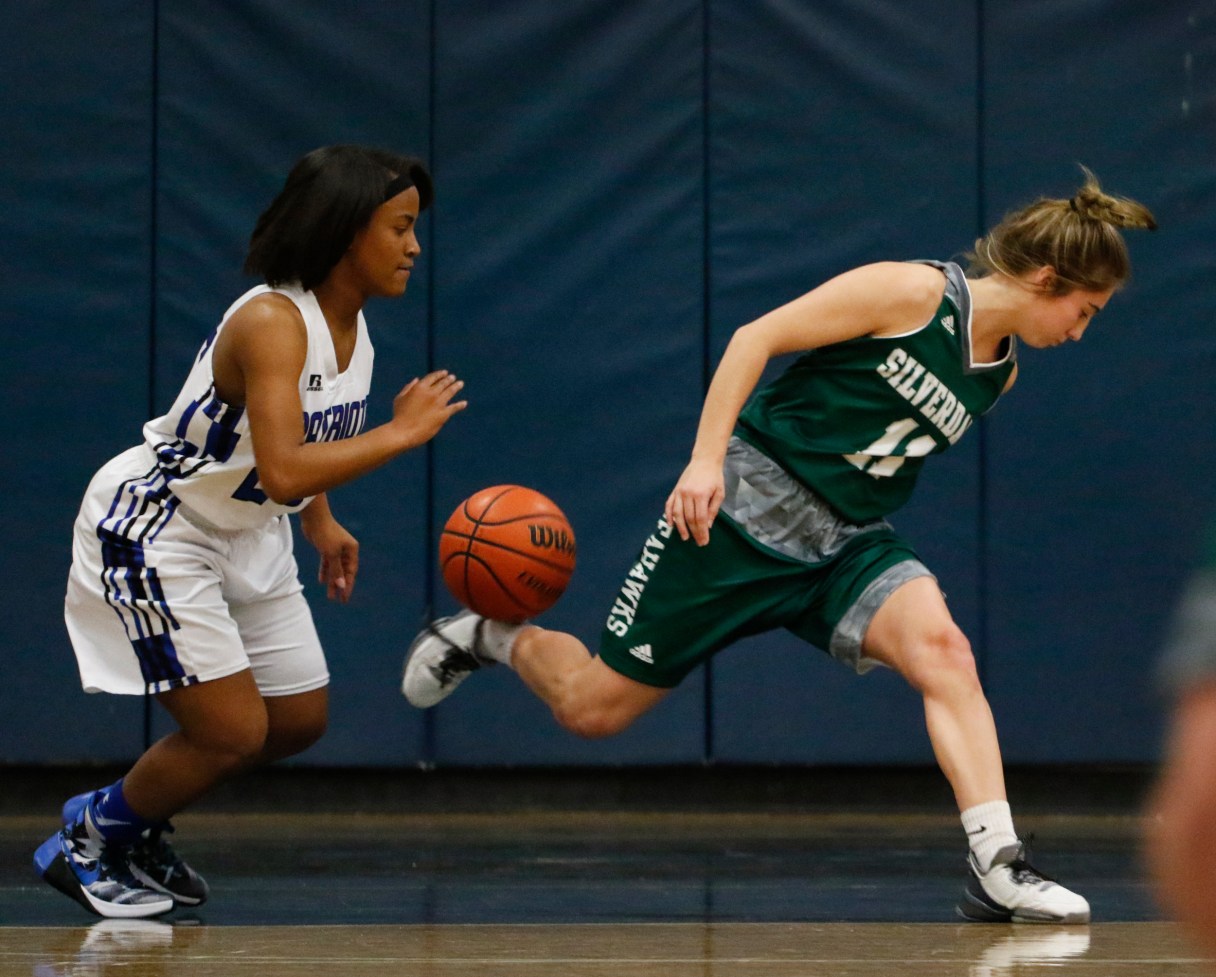 Staff Photo by Dan Henry / The Chattanooga Times Free Press- 2/12/16. Chattanooga School for the Arts and Sciences' Sheridan Randolph (25) steals the ball from Silverdale Baptist's Emily Harkleroad (11) during their matchup at the Lady Patriot's home court on Friday, February 12, 2016. Arts and Sciences won over Silverdale with a final score of 49-44.