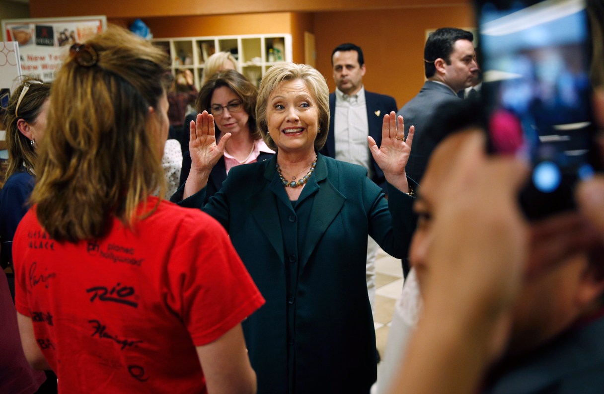 Democratic presidential candidate Hillary Clinton gestures while speaking to people at Planet Hollywood hotel and casino Friday, Feb. 19, 2016, in Las Vegas. (AP Photo/John Locher)
