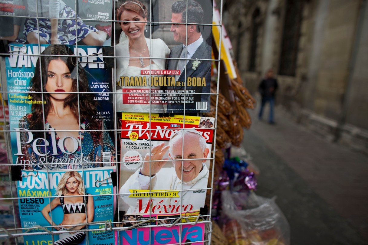 A magazine cover welcoming Pope Francis to Mexico is displayed for sale alongside fashion and gossip magazines at a newsstand in Mexico City, Wednesday, Feb. 10, 2016. The pontiff will arrive to Mexico on Friday, Feb. 12 for a week-long visit. (AP Photo/Rebecca Blackwell)