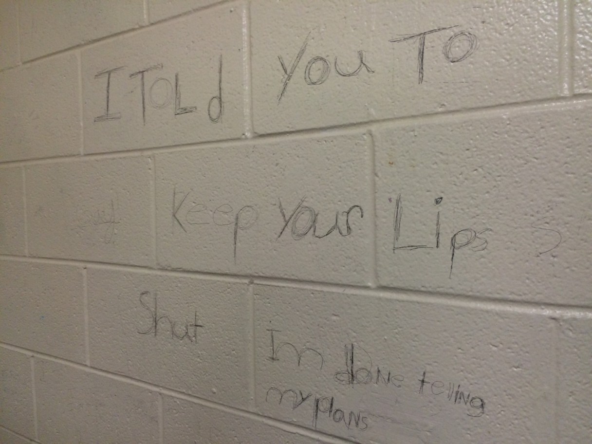 A message scrawled on the wall of the boys bathroom purports to be a threat against Ooltewah High School.