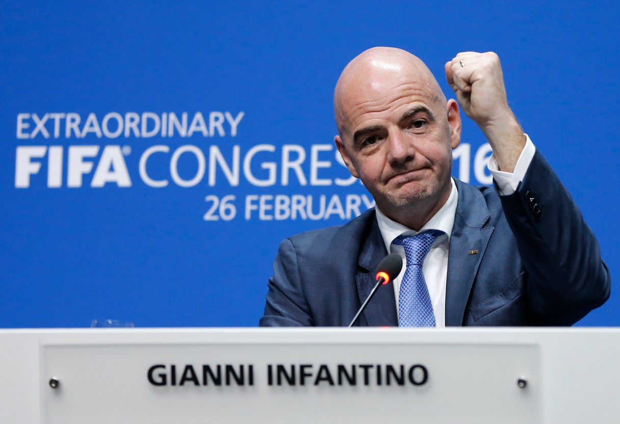 FILE - This is a Friday, Feb. 26, 2016 file photo of the newly elected FIFA president Gianni Infantino of Switzerland as he raises an arm during a press conference after the second election round during the extraordinary FIFA congress in Zurich, Switzerland. While acknowledging for the first time that votes were bought in past World Cup hosting contests, FIFA is seeking to claim "tens of millions of dollars" in bribe money seized by U.S. federal prosecutors. FIFA submitted a 22-page claim to the U.S. Attorney's Office in New York on Tuesday March 15, 2016 that seeks a big share in restitution from more than $190 million already forfeited by soccer and marketing officials who pleaded guilty in the sprawling corruption case. (AP Photo/Michael Probst, File)