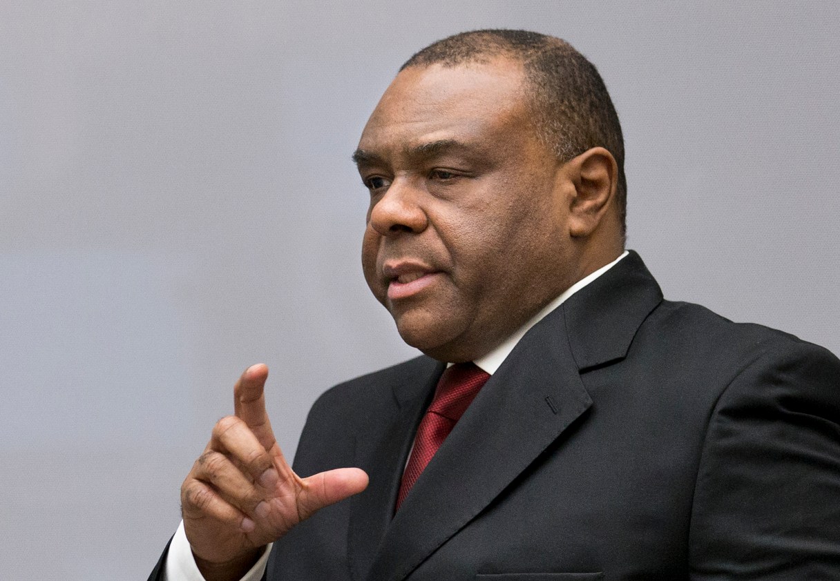 Jean-Pierre Bemba enters the court room of the International Criminal Court in The Hague, Netherlands, Monday, March 21, 2016. The International Criminal Court is passing judgment on former Congolese vice president Bemba on charges of commanding a militia that went on a spree of murder, rape and pillage in Central African Republic more than a decade ago. The verdicts being delivered Monday afternoon focus on the responsibility of a military commander for the actions of his troops. Bemba's long-running trial also was the first at the ICC to feature allegations of systematic sexual abuse by soldiers in a conflict. (AP Photo/Jerry Lampen, Pool)