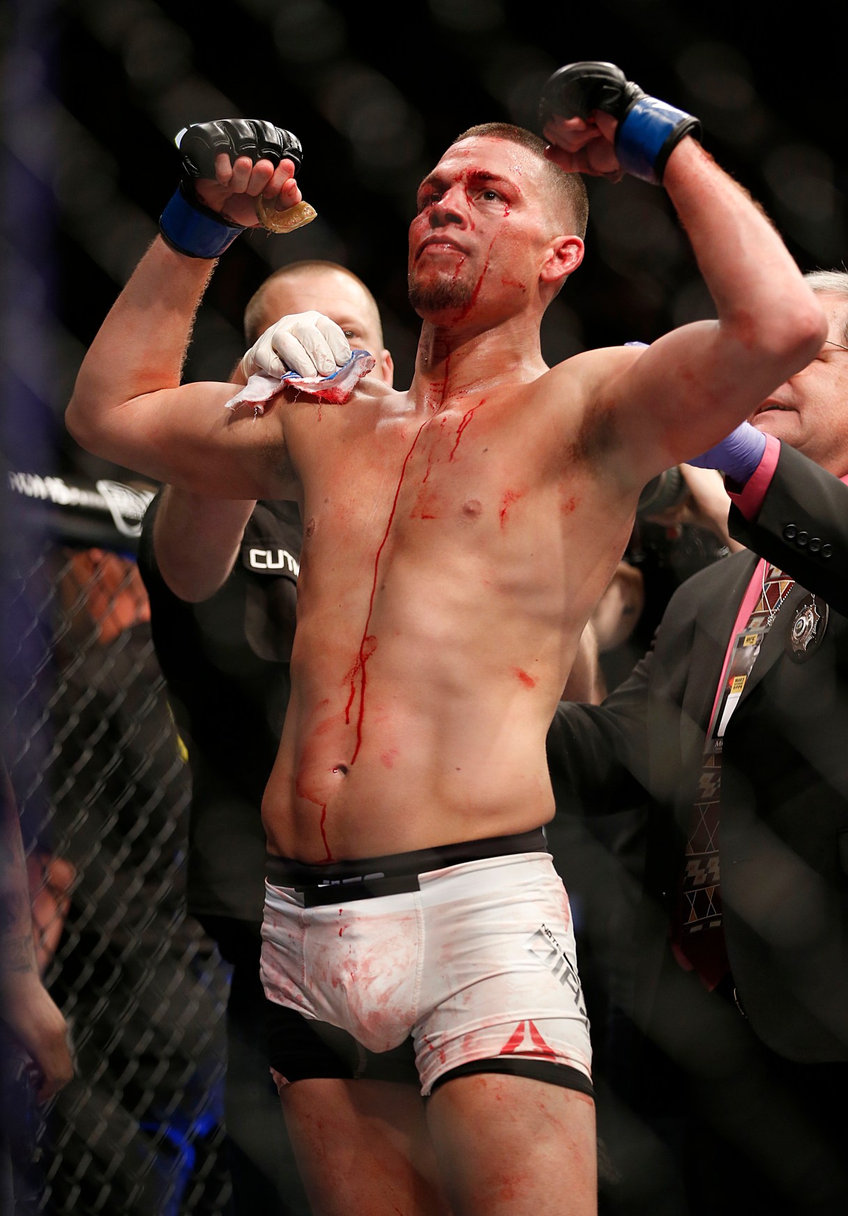 Nate Diaz, left, celebrates his second -ound submission victory over Conor McGregor during their UFC 196 welterweight mixed martial arts match Saturday, March 5, 2016, in Las Vegas. (AP Photo/Eric Jamison)