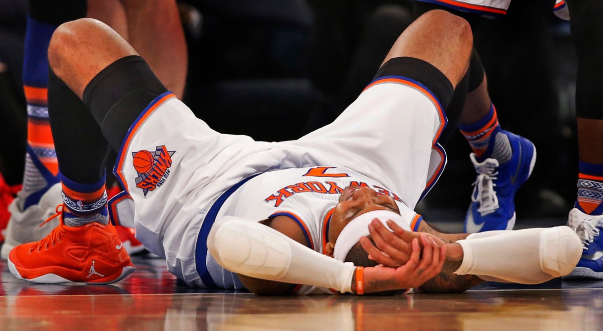 New York Knicks forward Carmelo Anthony (7) lies on the court after getting knocked down during the first half of an NBA basketball game against the Portland Trail Blazers at Madison Square Garden in New York, Tuesday, March 1, 2016. The Blazers won 104-85. (AP Photo/Kathy Willens)
