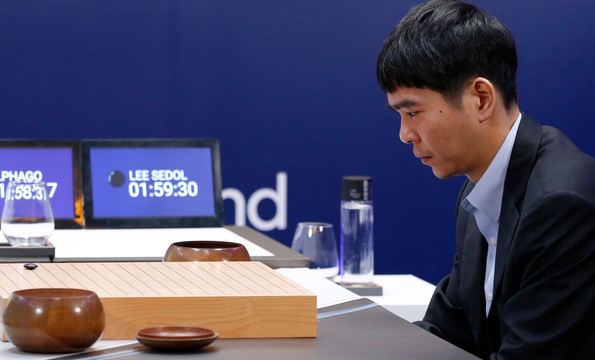 South Korean professional Go player Lee Sedol waits after putting the first stone against Google's artificial intelligence program, AlphaGo, during the third match of the Google DeepMind Challenge Match in Seoul, South Korea, Saturday, March 12, 2016. The human Go champion said he was left "speechless" after his second straight loss to Google's Go-playing machine on Thursday in a highly-anticipated human versus machine face-off. (AP Photo/Lee Jin-man)