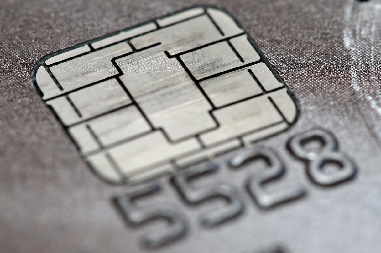 FILE -This June 10, 2015 photo shows a chip credit card in Philadelphia. Visa says its improving its smart chip-embedded cards, which have been the source of grumbling from businesses and customers forced to wait for transactions to go through. The company said Tuesday, April 19, 2016 that Quick Chip for EMV will let customers dip and remove cards, usually in two seconds or less, without waiting for purchases to be finalized. (AP Photo/Matt Rourke)