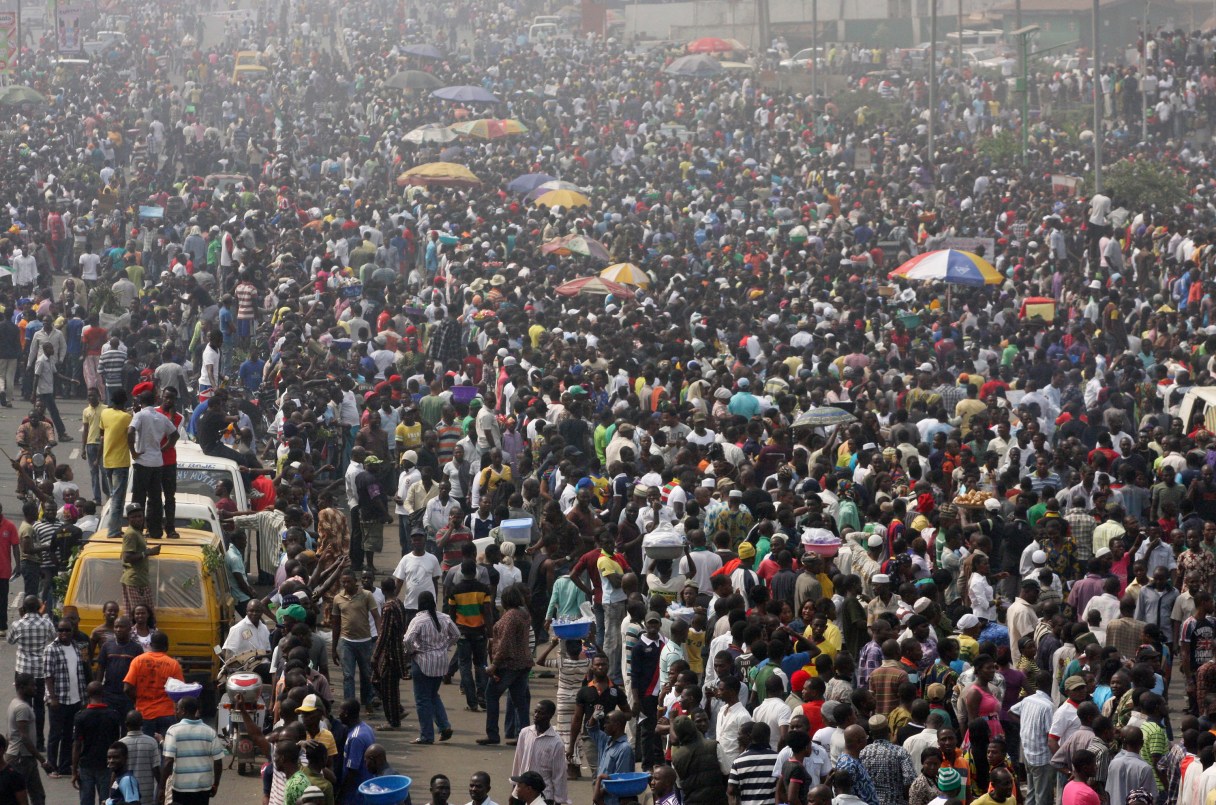 FILE - In this Friday, Jan. 13, 2012 file photo Hundreds of people demonstrate during a nationwide strike following the removal of fuel subsidy by the government in Lagos, Nigeria. Militant attacks on oil installations and a threatened nationwide strike are driving Nigeria's petroleum production and its naira currency to new lows. (AP Photo/Sunday Alamba, File)