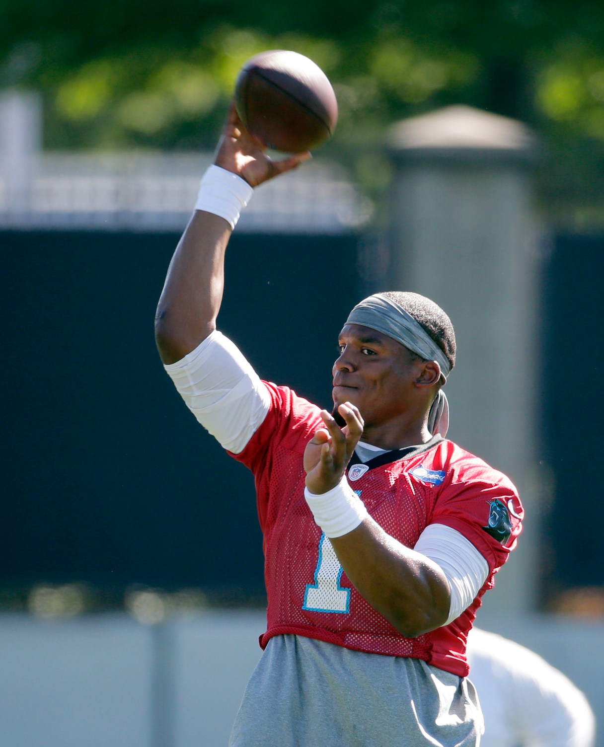Carolina Panthers' Cam Newton throws a pass during an NFL football practice in Charlotte, N.C., Tuesday, June 7, 2016. (AP Photo/Chuck Burton)