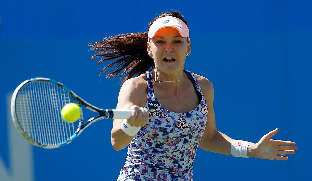 Poland's Agnieszka Radwanska returns to Slovakia's Dominika Cibulkova during their match in the Eastbourne International women's tennis tournament at Devonshire Park, Eastbourne England Friday June 24, 2016.(Steve Paston/PA via AP)