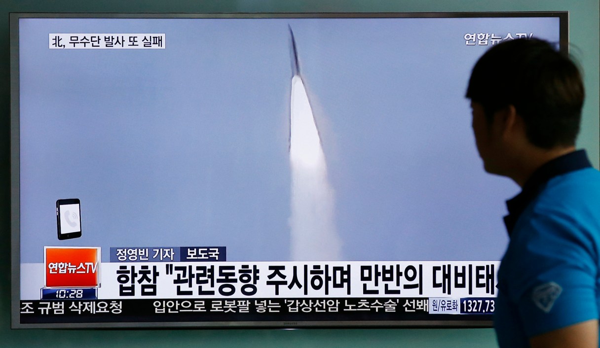 FILE - In this May 31, 2016, file photo, a man watches a TV news program reporting about a missile launch of North Korea, at the Seoul Train Station in Seoul, South Korea. In a remarkable show of persistence, North Korea on Wednesday, June 22, 2016, fired two suspected powerful new Musudan mid-range missiles, U.S. and South Korean military officials said, but at least one of the launches apparently failed, Pyongyang's fifth such reported flop since April. The letters read on top left: "Fail, North Korea's Musudan missile." (AP Photo/Lee Jin-man)