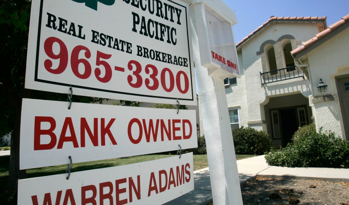 FILE - In this July 2, 2008, file photo, a bank-owned home is seen for sale in Sacramento, Calif. Consumer groups say a recent ruling from the Washington state Supreme Court could have a broad effect on how some mortgage companies respond when homeowners miss payments. (AP Photo/Rich Pedroncelli, File)