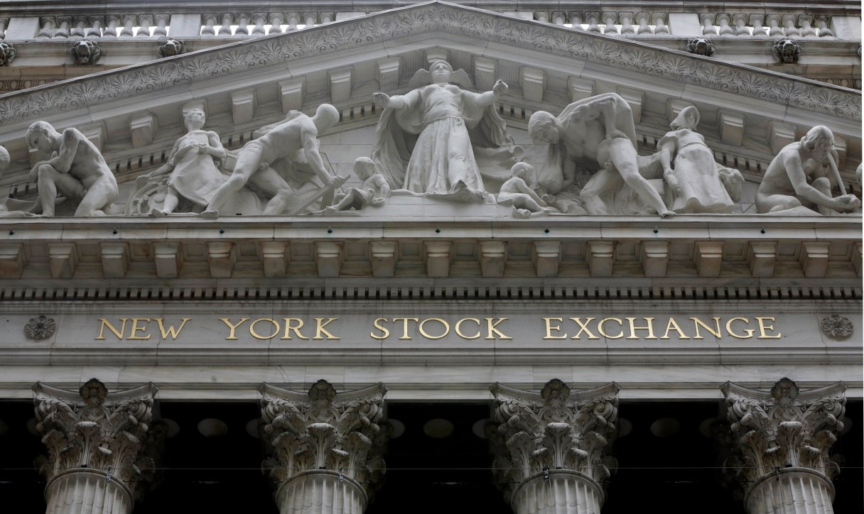 FILE - This Oct. 4, 2014, file photo, shows the facade of the New York Stock Exchange. U.S. stocks continued to fall early Wednesday, July 6, 2016, as investors snap up bonds. Yields on long-term Treasury notes remained near all-time lows. The prices of gold and silver, which are around two-year highs, rose further. Phone company stocks and banks took some of the biggest losses. (AP Photo/Richard Drew, File)