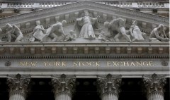 FILE - This Oct. 4, 2014, file photo, shows the facade of the New York Stock Exchange. U.S. stocks continued to fall early Wednesday, July 6, 2016, as investors snap up bonds. Yields on long-term Treasury notes remained near all-time lows. The prices of gold and silver, which are around two-year highs, rose further. Phone company stocks and banks took some of the biggest losses. (AP Photo/Richard Drew, File)