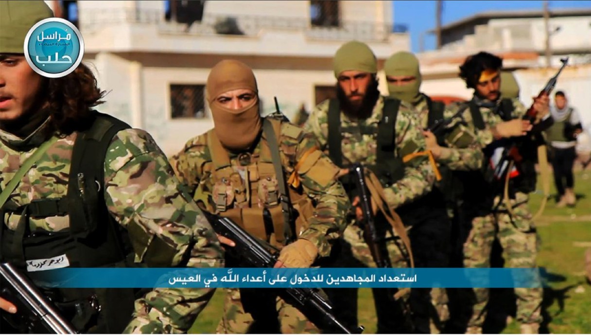 FILE - This file photo posted on the Twitter page of Syria's al-Qaida-linked Nusra Front on April 1, 2016, shows fighters from al-Qaida's branch in Syria, the Nusra Front, marching toward the northern village of al-Ais in Aleppo province, Syria. The leader of Syria’s Nusra Front said Thursday, July 28, 2016 that his group is changing name, and claims it will have no more ties with al-Qaida. (Al-Nusra Front via AP, File)