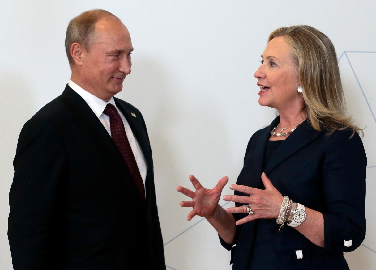 ADVANCE TO GO WITH RUSSIA US CLINTON FILE In this file photo taken on Saturday, Sept. 8, 2012, Russian President Vladimir Putin, left, meets U.S. Secretary of State Hillary Rodham Clinton on her arrival at the APEC summit in Vladivostok, Russia. During her recent acceptance of the Democratic party nomination to run for the U.S. presidency, Clinton said Russia is an enemy and cannot be trusted, a statement which clearly stung the Kremlin and seems to have heralded a new era for the coming presidency if Clinton wins. (AP Photo/Mikhail Metzel, pool, FILE)