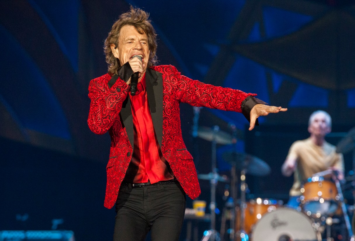 FILE - In this July 4, 2015 file photo, Mick Jagger of the Rolling Stones performs at the Indianapolis Motor Speedway in Indianapolis, Ind. Jagger's representatives say the rock legend is expecting his eighth child. The representatives confirmed a report by People magazine and other media outlets that Jagger's girlfriend, Melanie Hamrick, 29, is pregnant. (Photo by Barry Brecheisen/Invision/AP, File)