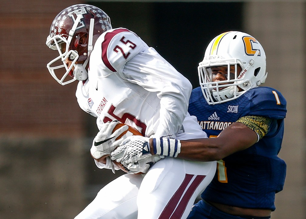 UTC defensive back Trevor Wright, right, tackles Fordham wide receiver Jordan Allen during a playoff game last season at Finley Stadium.