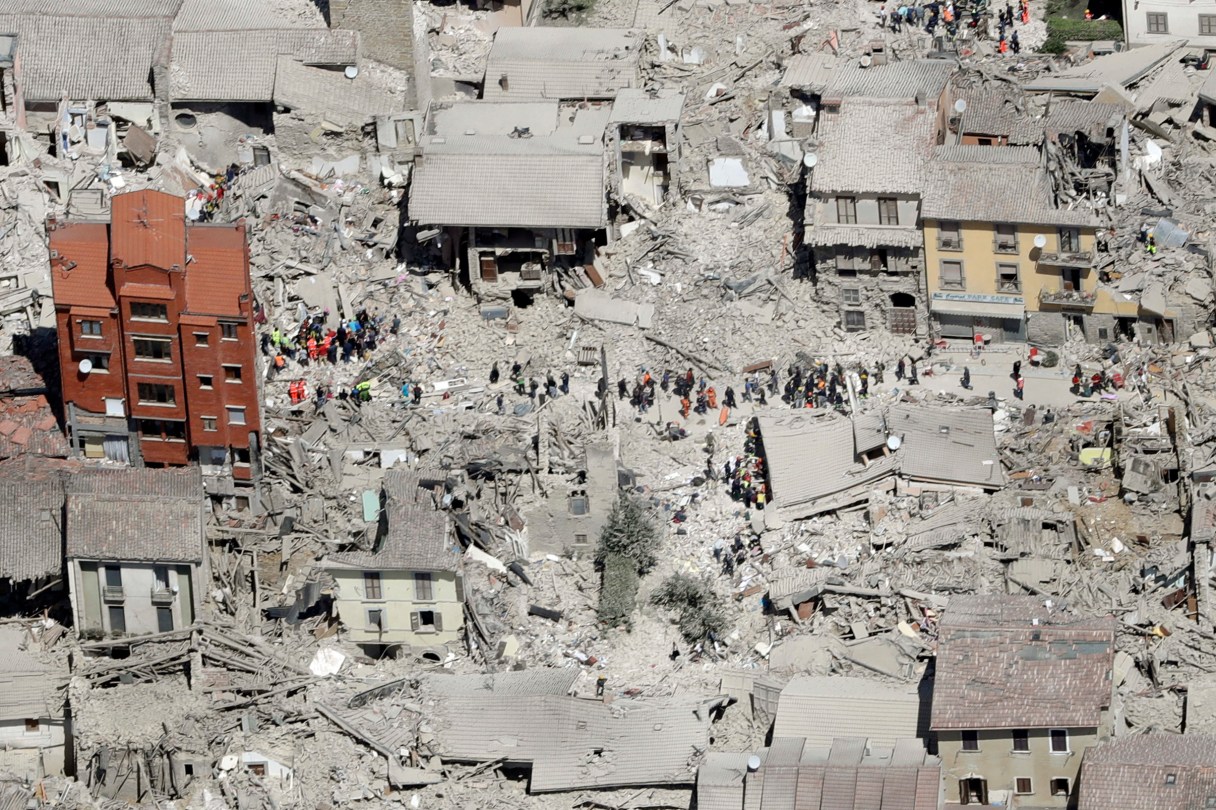 This aerial photo shows the damaged buildings in the town of Amatrice, central Italy, after an earthquake, Wednesday, Aug. 24, 2016. The magnitude 6 quake struck at 3:36 a.m. (0136 GMT) and was felt across a broad swath of central Italy, including Rome where residents of the capital felt a long swaying followed by aftershocks. (AP Photo/Gregorio Borgia)