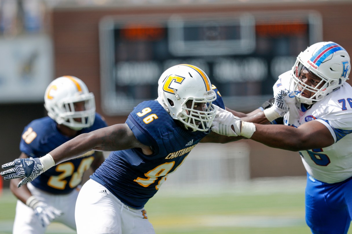 UTC defensive lineman Vantrel McMillan (96) grapples with Presbyterian offensive lineman Tobias Hagins during the Mocs' home football game against Presbyterian at Finley Stadium on Saturday, Sept. 10, 2016, in Chattanooga, Tenn.