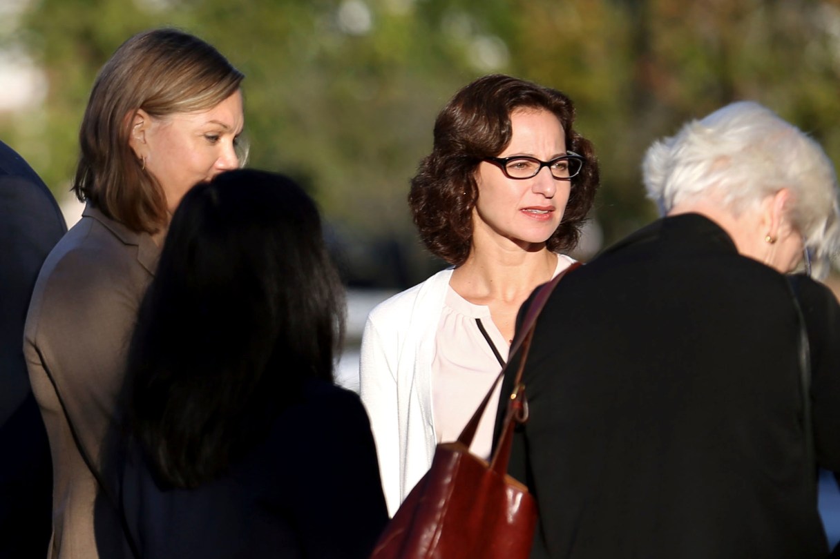 Sabrina Erdely, center, enters the federal courthouse in Charlottesville, Va., on Monday, Oct. 17, 2016. Erdely, author of "A Rape on Campus," a discredited Rolling Stone article detailing an alleged rape at the University of Virginia, is being sued by Nicole Eramo, a UVa administrator included in the story. (Ryan M. Kelly/The Daily Progress via AP)