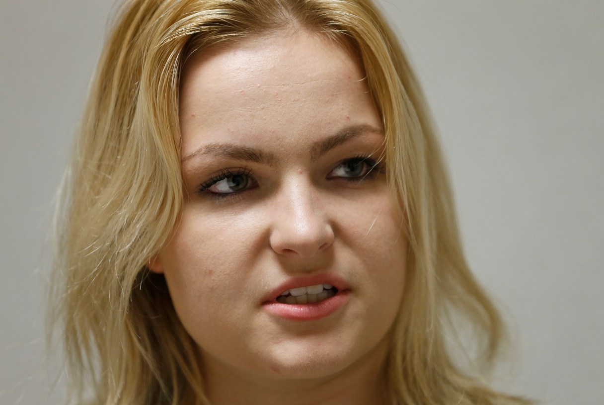 In this Monday, Oct. 10, 2016, photo, University of Richmond junior and sexual assault victim, Whitney Ralston, speaks during an interview in Richmond, Va. Ralston, who says she was sexually assaulted by a classmate at the Richmond school, said Donald Trump's vulgar remarks that were caught on videotape and his that it was “locker room” talk normalizes violence against women. (AP Photo/Steve Helber)