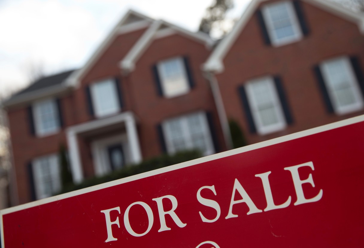 FILE - This Thursday, Dec. 3, 2015, file photo shows an existing home for sale in Roswell, Ga. On Thursday, Nov. 10, 2016, mortgage giant Freddie Mac reported that long-term U.S. mortgage rates rose during the week for a second straight week. (AP Photo/John Bazemore, File)