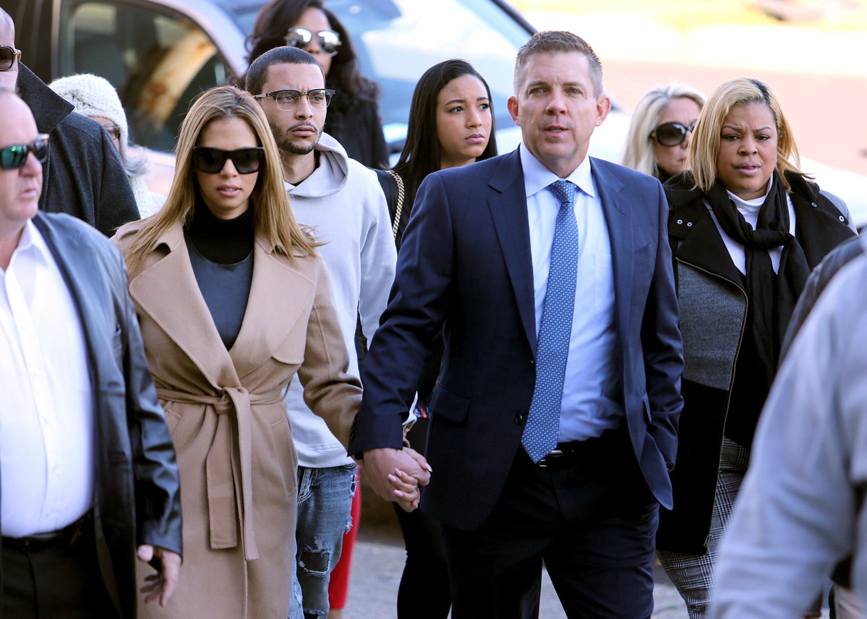 New Orleans Saints head coach Sean Payton walks with Will Smith's widow Racquel into Orleans Criminal Court for the trial of Cardell Hayes on Saturday, Dec. 10, 2016 in New Orleans. Hayes killed Will Smith in a road rage incident, in which Smith's wife was also shot and wounded. (Michael DeMocker/NOLA.com The Times-Picayune via AP)