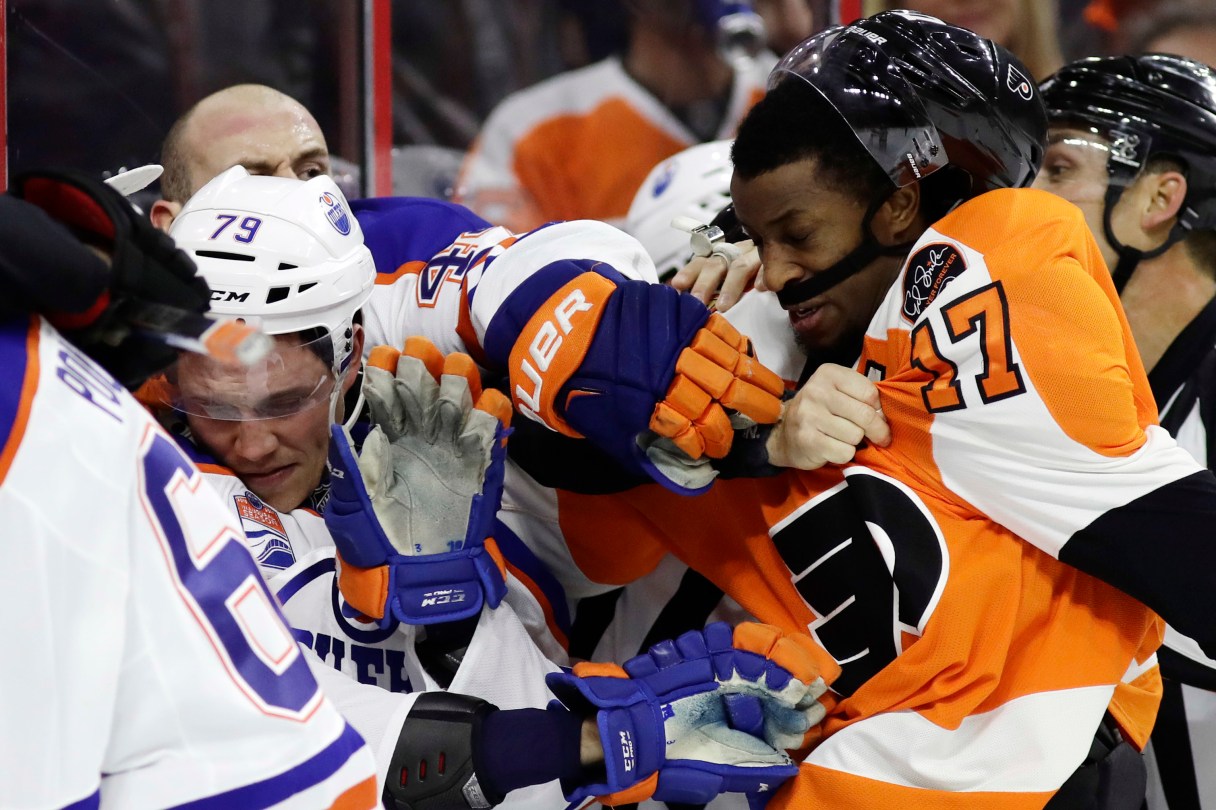 Philadelphia Flyers' Wayne Simmonds (17) and Edmonton Oilers' Dillon Simpson (79) scuffle during the second period of an NHL hockey game, Thursday, Dec. 8, 2016, in Philadelphia. (AP Photo/Matt Slocum)