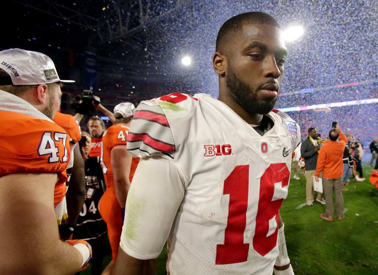 Ohio State quarterback J.T. Barrett leaves the field after the team's Fiesta Bowl NCAA college football playoff semifinal against Clemson, Saturday, Dec. 31, 2016, in Glendale, Ariz. Clemson won 31-0 to advance to the BCS championship game on Jan. 9 against Alabama. (AP Photo/Rick Scuteri)