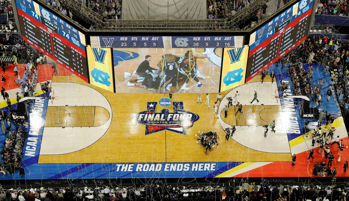 FILE - In this April 4, 2016, file photo, Villanova players collapse on the court after they defeated North Carolina 77 in the championship game of the NCAA Final Four college basketball tournament in Houston. The selection committee for the NCAA men’s basketball tournament is getting into the bracketology business and borrowing an idea from the College Football Playoff, hoping it will get more fans thinking about March Madness in February. The NCAA and CBS Sports announced Tuesday, Jan. 24, 2017, that for the first time the committee will give a look at its top 16 seeds one month before the 68-team field locks in on March 12. (AP Photo/Morry Gash, File)