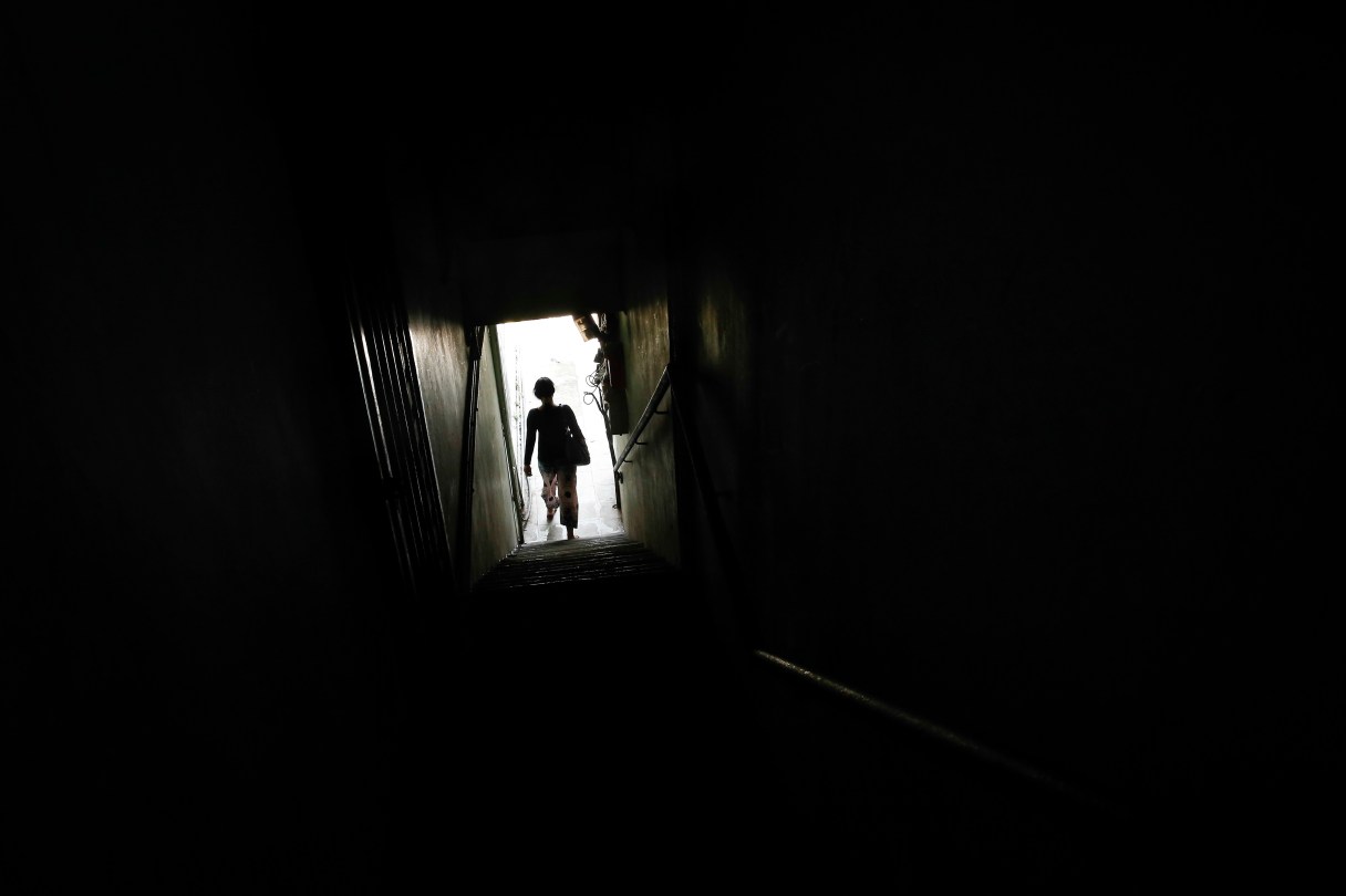 In this March 11, 2017 photo, Tin, a Christian Burmese refugee, leaves a school after dropping off her children in Kuala Lumpur, Malaysia. Tin is a Christian Burmese who fled Myanmar and is hoping to resettle in the United States. An Associated Press analysis suggests that the people hurt most by President Donald Trump's planned deep cuts in refugee visas are from not any of the six Muslim countries listed in his travel ban, but Myanmar. (AP Photo/Joshua Paul)