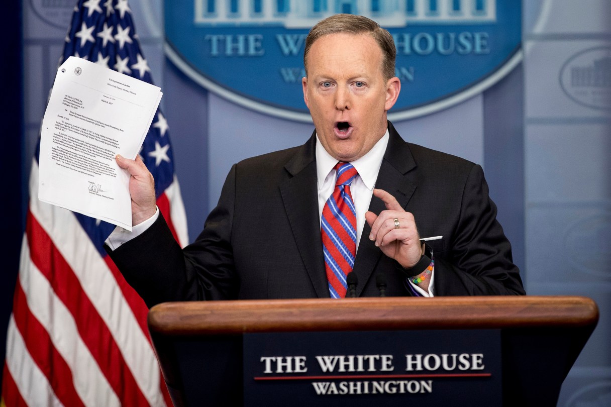 White House press secretary Sean Spicer holds up a document concerning a Washington Post story on Sally Yates as he talks to the media during the daily press briefing at the White House in Washington Tuesday, March 28, 2017. Spicer discussed the Supreme Court nominee Justice Neil Gorsuch, jobs, healthcare, and other topics. (AP Photo/Andrew Harnik)