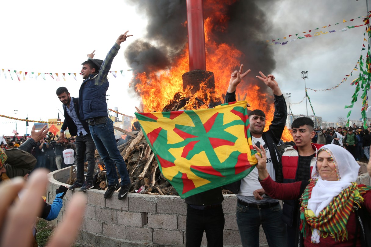 People gather around a bonfire after Turkish authorities permitted the Newroz celebration, in Diyarbakir, Turkey, Tuesday, March 21, 2017. Thousands celebrated the Newroz festival in Istanbul and in Diyarbakir, a mainly Kurdish city in a region where Kurdish militants regularly clash with government forces. Many flags proclaimed “No” in the Turkish and Kurdish languages, referring to President Recep Tayyip Erdogan’s bid to gain more power for his office in an April 16 referendum.
(AP Photo/Lefteris Pitarakis)